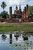 Thailand, Old Sukhothai - Wat Mahathat, the remains of a bot with a large seated Buddha.